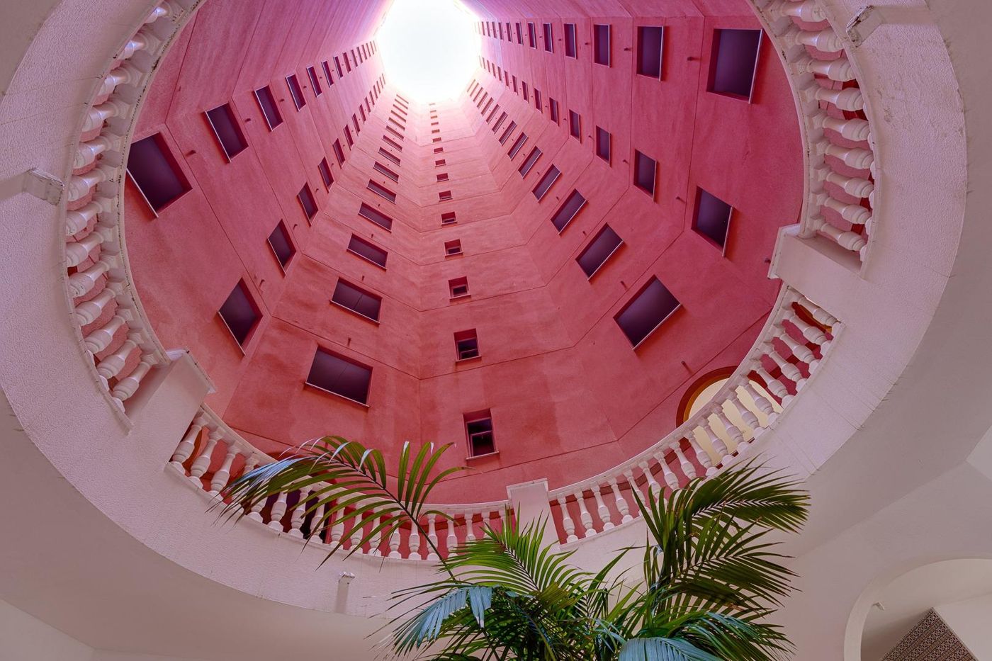 Looking up the pink atrium of the tower