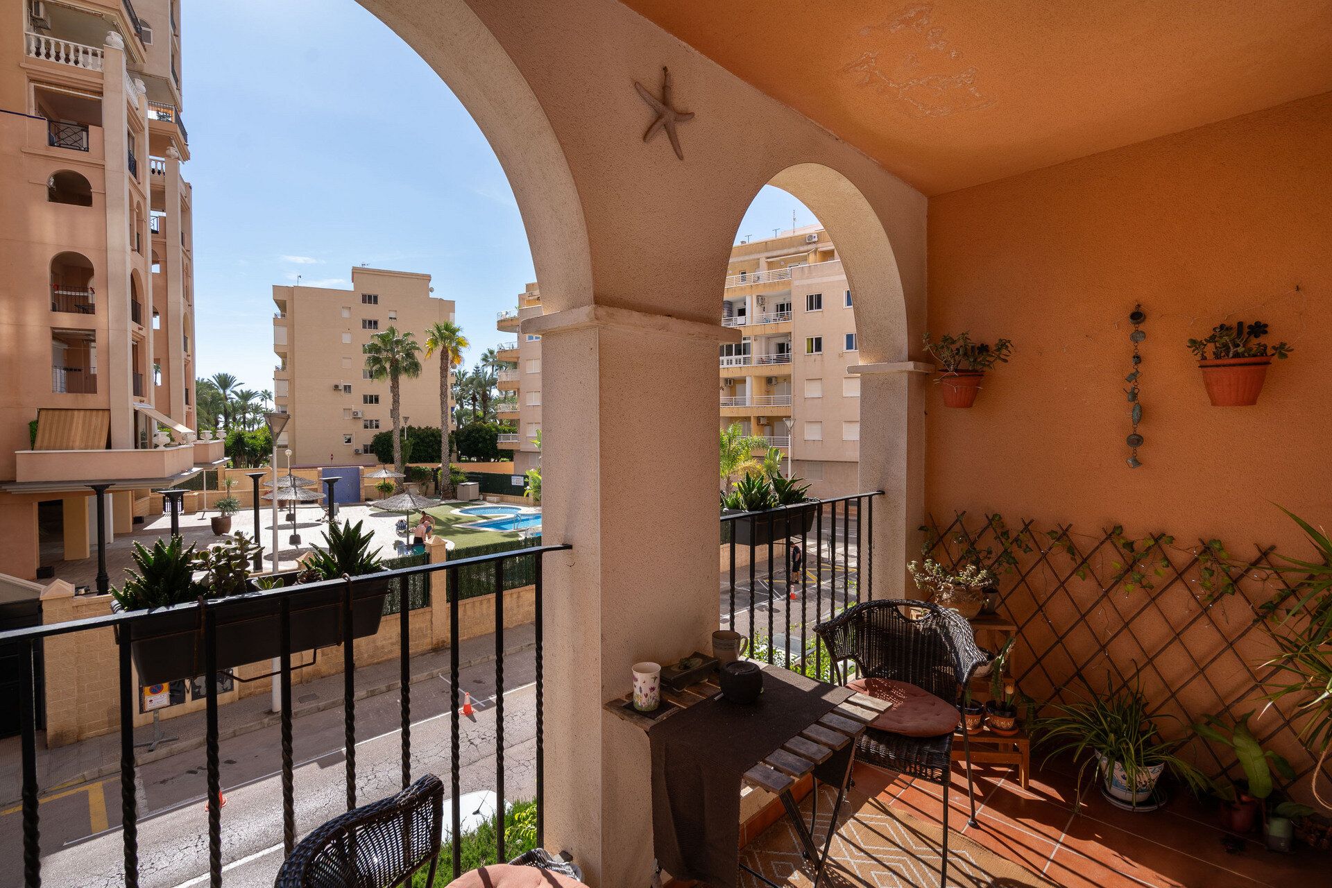 The arched loggia looking over the pool garden